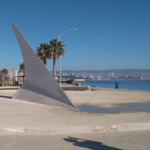 Scenic view of beach against clear blue sky