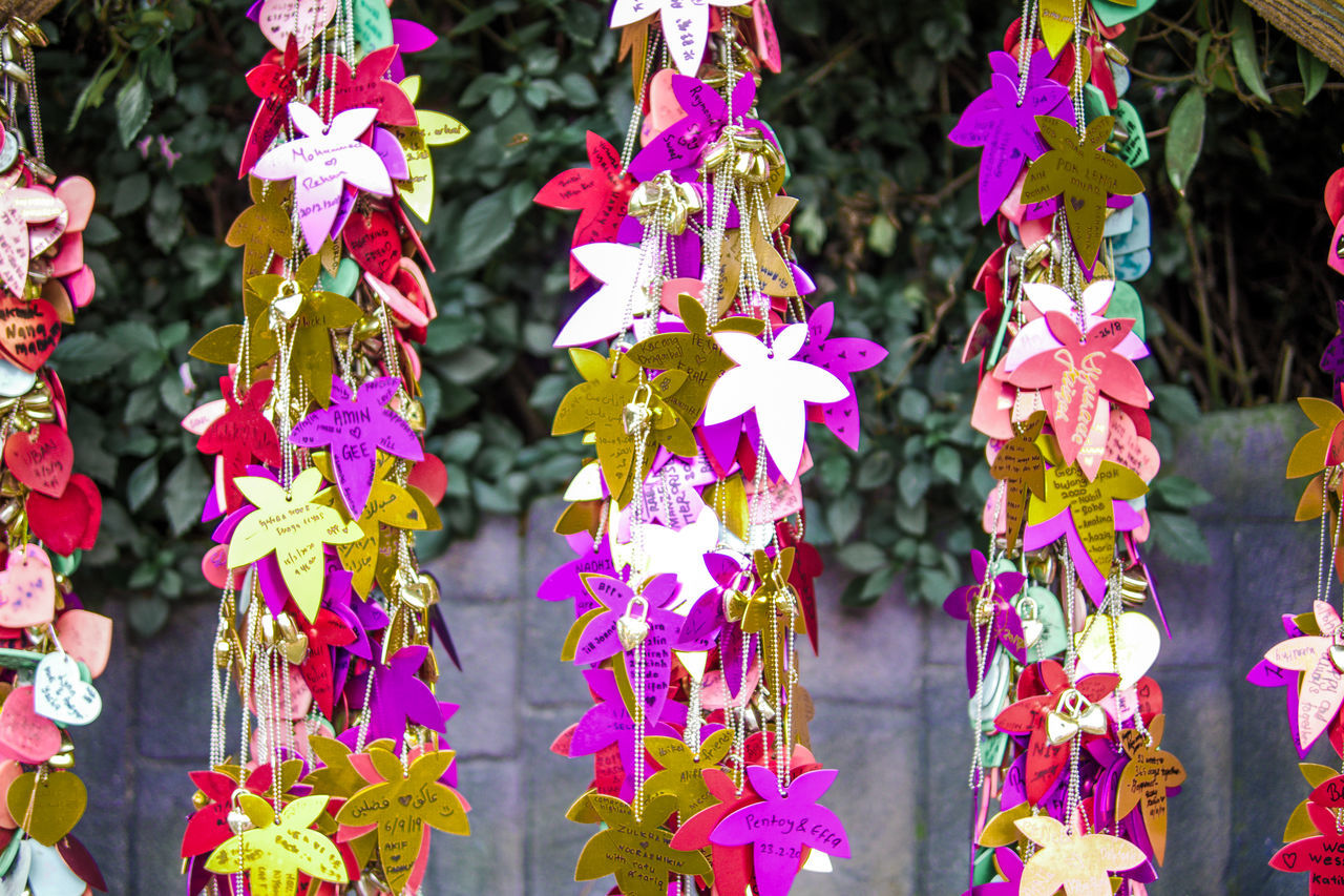 CLOSE-UP OF MULTI COLORED DECORATION HANGING FOR SALE