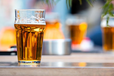 Close-up of beer glass on table