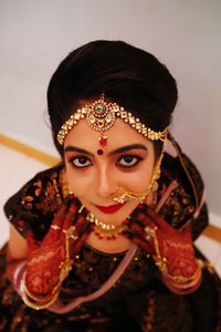 High angle portrait of beautiful bride wearing traditional clothing and jewelry