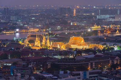 High angle view of buildings in city at night