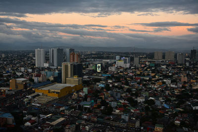 High angle view of buildings against sky during sunset