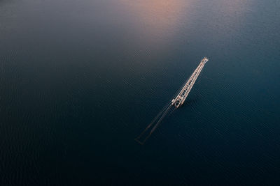 Aerial view of crane in sea