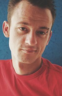 Close-up portrait of smiling young man