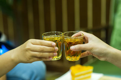 Midsection of woman holding drink