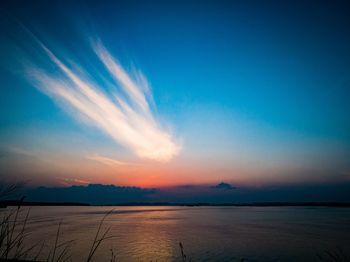 Scenic view of sea against sky at sunset