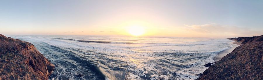 Scenic view of sea against sky during sunset