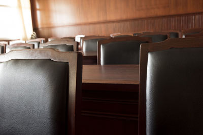 Empty chairs and tables in courtroom