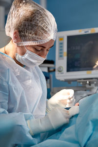 Doctor examining patient in hospital