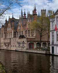 Canal side exterior view of palace of the liberty of bruges in bruges, belgium
