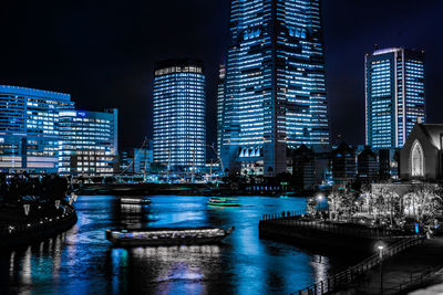 Illuminated buildings in city at night