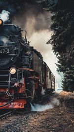 Train on railroad track against sky