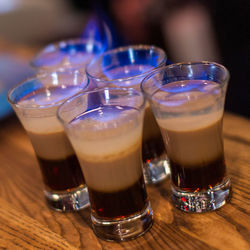 Close-up of flame over drink on table