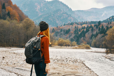 Rear view of man standing on mountain