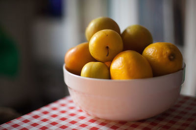 Close-up of fruits in bowl on table