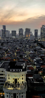 High angle view of buildings against sky during sunset