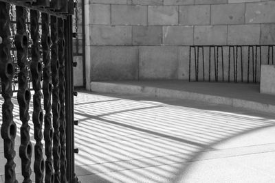 Shadow of fence on wall