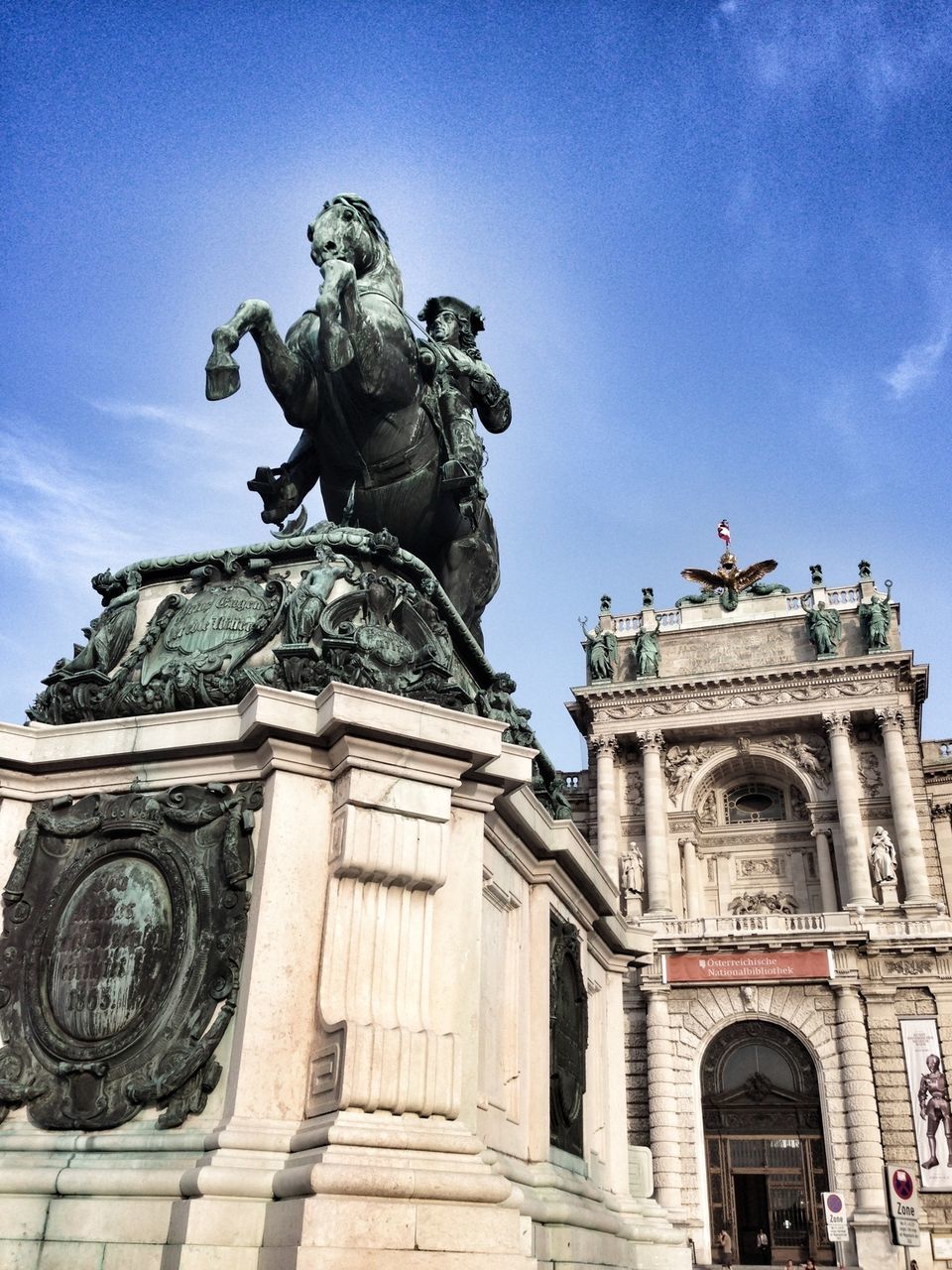 statue, human representation, sculpture, art and craft, art, creativity, low angle view, architecture, built structure, building exterior, travel destinations, famous place, sky, travel, tourism, history, international landmark, animal representation