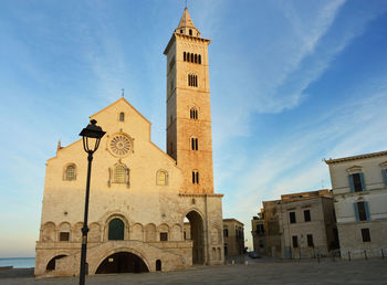 Low angle view of clock tower against sky