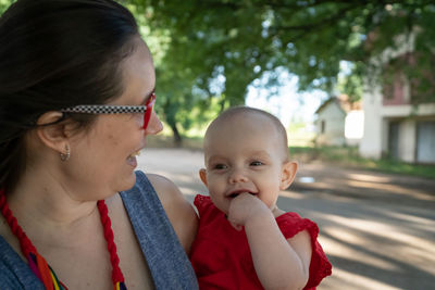 Portrait of a smiling girl with woman