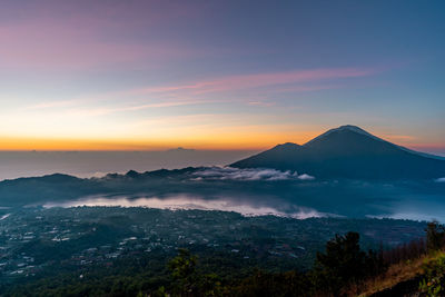 Scenic view of mountains against sky during sunset