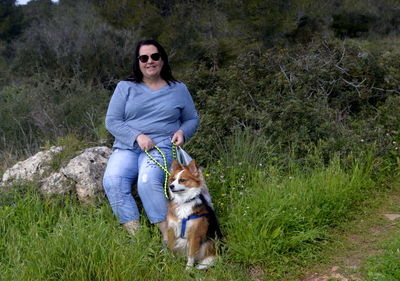 Portrait of man with dog on land