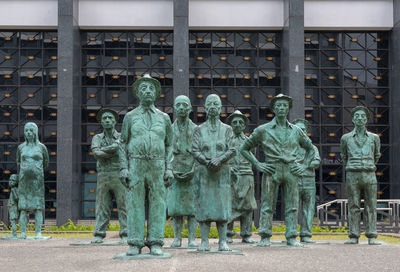 Statue against building