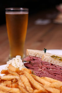 Close-up of food and beer on table