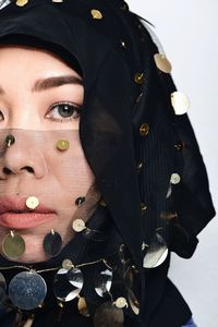 Close-up portrait of woman wearing hijab