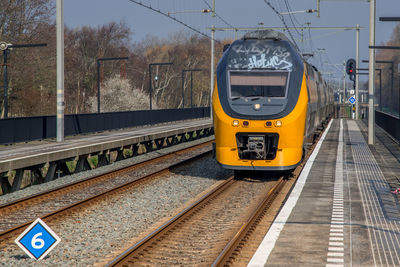 Amsterdam, netherlands, march 2022. dutch train in the landscape and in the central station