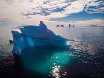 Scenic view of frozen sea against sky