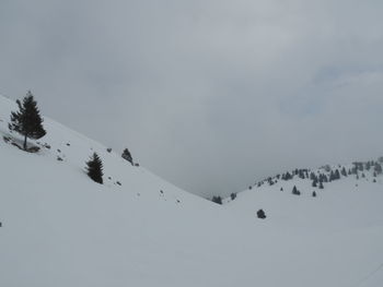 Scenic view of snow covered mountain against sky