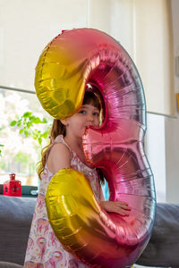 Portrait of cute girl with a balloon