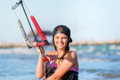 Portrait of young woman swimming in sea