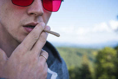 Close-up of man smoking cigarette