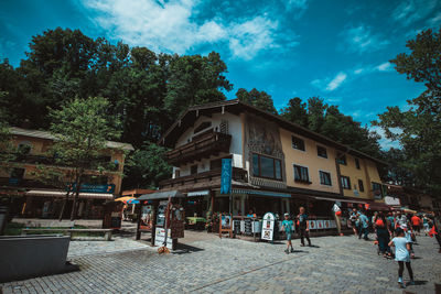 People at town square against sky