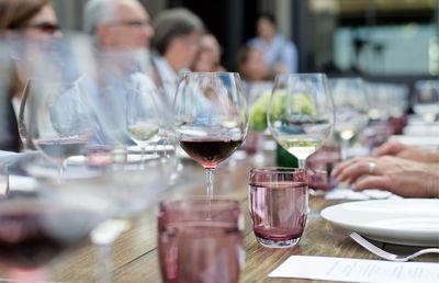 Close-up of wine glasses on dining table