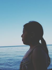 Portrait of young woman in sea