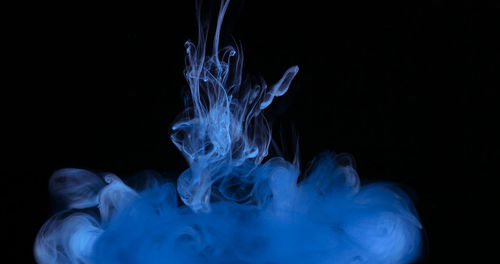 Close-up of water splashing against black background