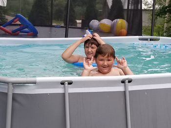 Portrait of smiling boy in swimming pool