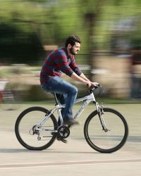 Blurred motion of man walking on road