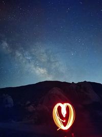 Low angle view of mountain against sky at night