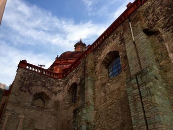 Low angle view of old building against sky