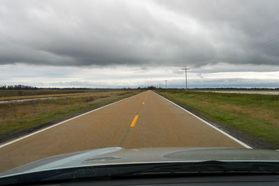 Road seen through car windshield