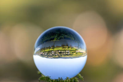 Crystal ball with lriver moselle valley and defocused background