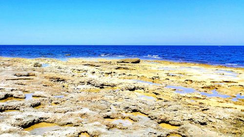 Scenic view of sea against clear sky