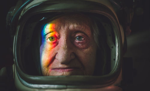 Close-up portrait senior woman wearing space suit