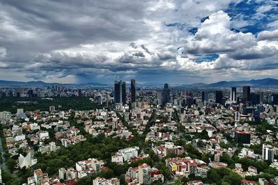 Aerial panoramic shot of mexico city skyline against stormy sky