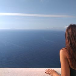 Rear view of woman looking at sea
