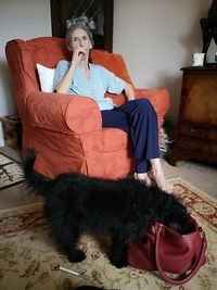 Man sitting on chair at home